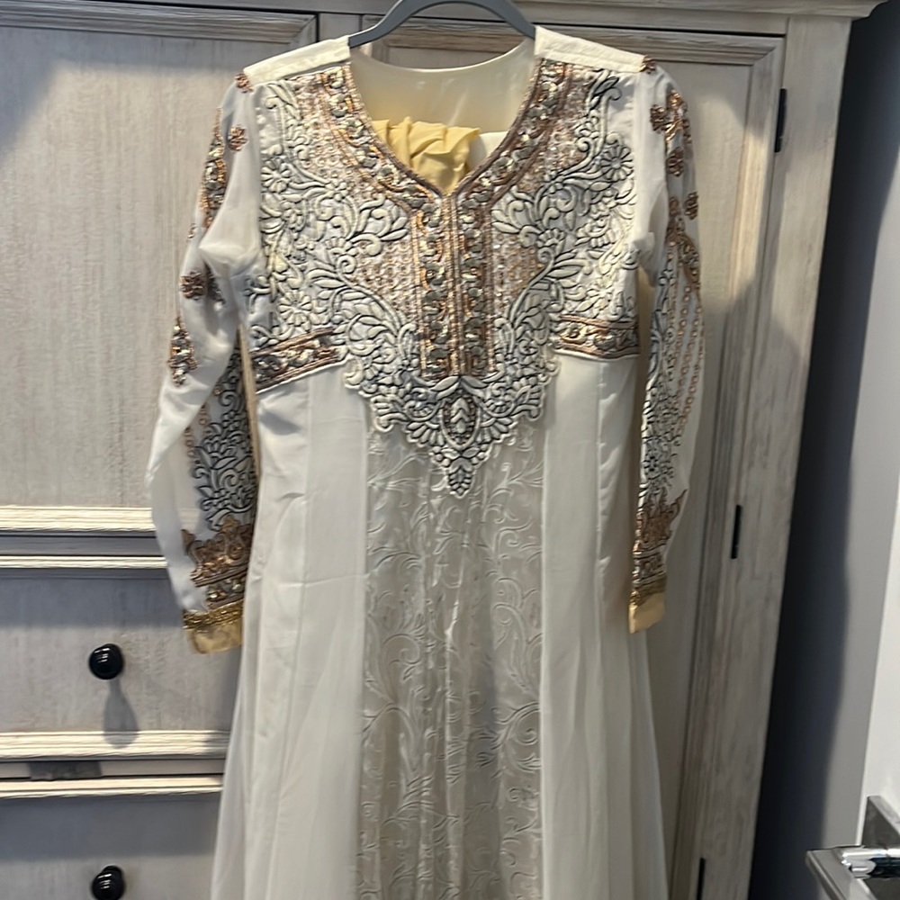 White with gold work long dress with gold work. Comes with pants and duppata.